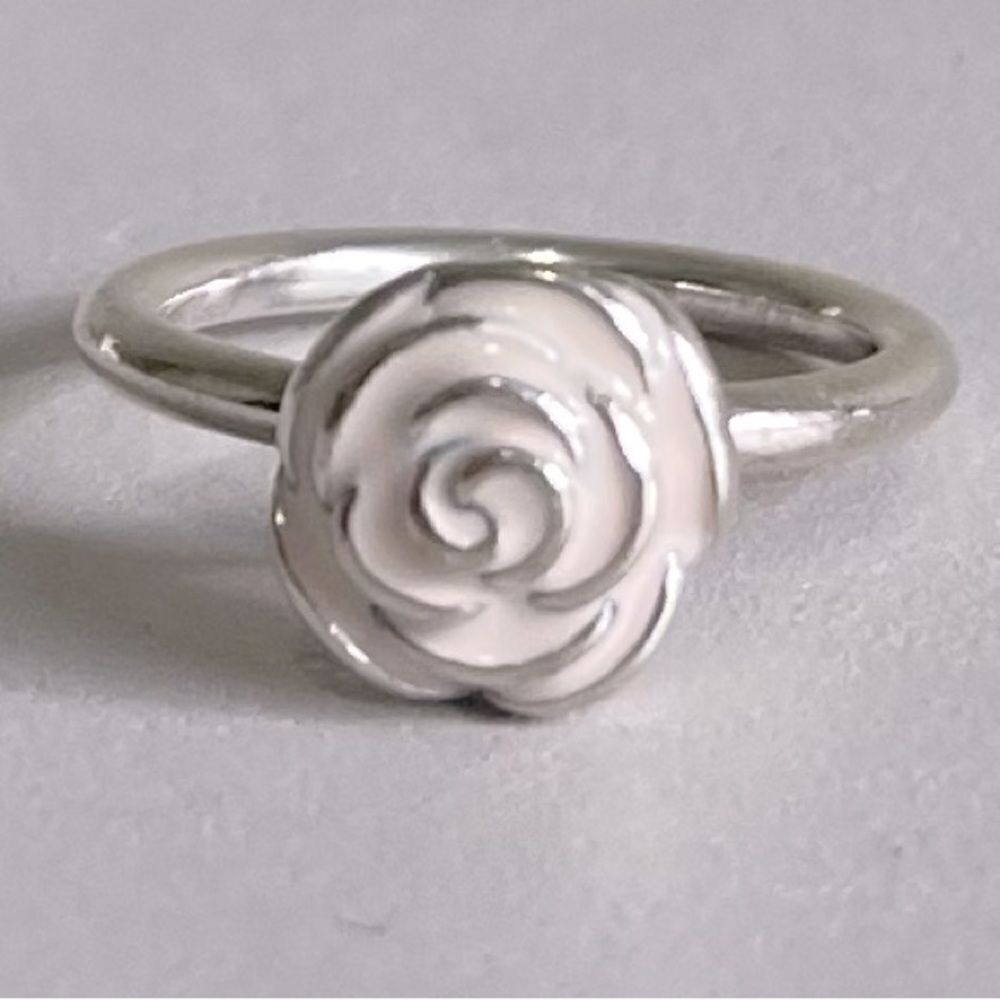 Pandora Silver Rose with pale pink inlay.